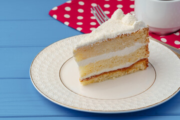 Wall Mural - Piece of white biscuit cake on plate