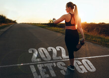 Let's Go To Year 2022. Woman Waiting At The Starting Line To Start The New Year 2022. New Goals,plans And Visions.