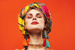 beautiful woman ethnicity multicolored headscarf makeup glamor red background