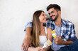 © didesign - Happy young couple relaxing after painting