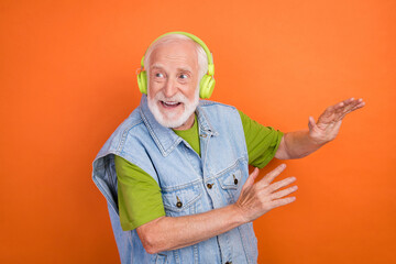 Sticker - Photo of funny funky retired man wear vintage jeans waistcoat listening music headphones dancing smiling isolated orange color background