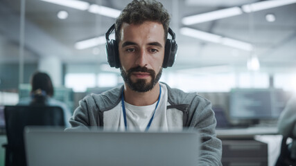 Aufkleber - Office: Portrait of Smiling IT Programmer Wearing Headphones Working on Desktop Computer. Male Website Developer, Software Engineer Developing App, Video Game. Listening to Podcast, Music. Close-up