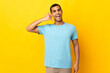 © luismolinero - African American man over isolated background making phone gesture. Call me back sign