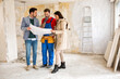 © didesign - Young couple shows to builder handyman problem about renovations their home