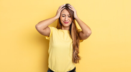 Wall Mural - asian pretty woman feeling stressed and frustrated, raising hands to head, feeling tired, unhappy and with migraine