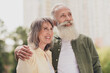 © deagreez - Photo of happy dreamy grey haired positive old couple look enjoy weekend summer good mood outside outdoors in park