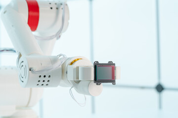 Canvas Print - Robot arm with CCD and CMOS matrix Image sensor in the manipulator. Concept on the topic of artificial vision and pattern recognition