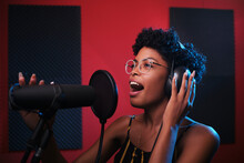 Black Woman Singing In Recording Studio