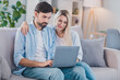 © deagreez - Photo of confident two people sit divan typing surf internet wear casual outfit in comfortable home indoors