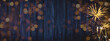 HAPPY NEW YEAR 2022 - Festive silvester background panorama banner long - Golden yellow fireworks, sparklers and champagne classes toasting on rustic blue wooden wall texture with bokeh lights