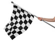 © New Africa - Woman holding checkered finish flag on white background, closeup