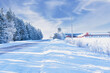 Snow covered road running through the farmland of rural Prince Edward Island, Canada.
