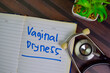 Vaginal Dryness write on a book isolated on Wooden Table.