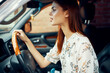 © VICHIZH - cute red-haired woman driving a car lifestyle trip