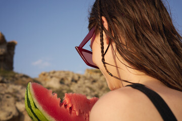 Wall Mural - Cheerful woman eating watermelon nature summer vacation