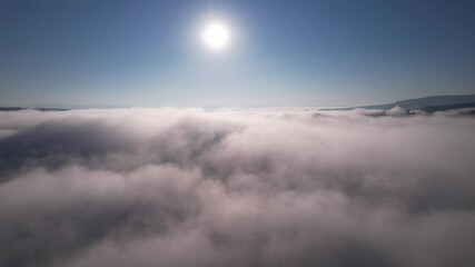Wall Mural - move forward to sun is rising above the morning mists fog of clouds over the tree-covered mountain s