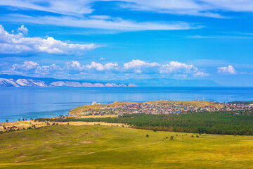 Wall Mural - View from hill to Khuzhir village of Olkhon island and Maloe More bay of lake Baikal, Russia. Picturesque summer landscape, beautiful background. Discovering distant places of Earth, travel concept