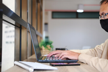 Poster - Businessman is using a laptop computer, while a businessman is working in his office. Freelancing, student life, e-learning, studying, web site, and technology are all topics that come up