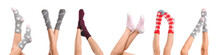 Legs Of Young Woman In Socks On White Background