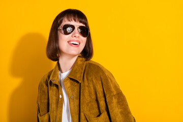 Wall Mural - Photo of funny charming young lady wear cowgirl outfit dark glasses smiling looking empty space isolated yellow color background