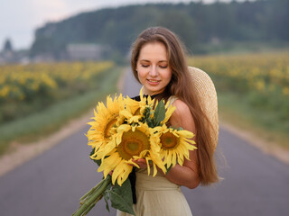 beautiful caucasian girl in a field of sunflowers