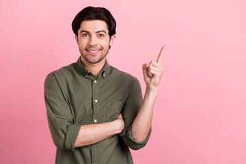 Poster - Photo of young happy charming cheerful man point finger empty space sale news isolated on pink color background