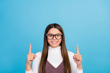 Canvas Print - Photo of youth pretty lady indicate fingers empty space direct promo advertise isolated over blue color background