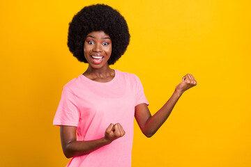 Poster - Photo of young african girl happy positive smile celebrate victory win lottery isolated over yellow color background