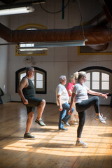 Seniors taking dance class. Group of retirees learning dance moves. Dance, hobby, healthy lifestyle concept