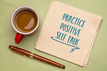 Poster - practice positive self talk - inspirational advice on a napkin with a cup of coffee, positive affirmation and personal development concept