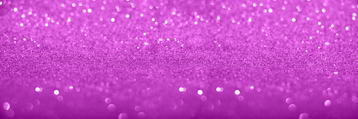  Defocused violet glittering background with shinig bokeh.Large banner with negative space.