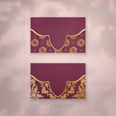 Wall Mural - Presentable burgundy business card with luxurious gold ornaments for your business.