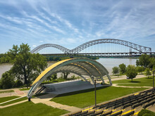 An Amphitheater By A Riverbank With A View Of A Bridge In New Albany, Indiana 