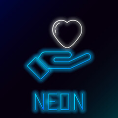 Poster - Glowing neon line Heart in hand icon isolated on black background. Hand giving love symbol. Valentines day symbol. Colorful outline concept. Vector