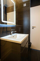 Sticker - modern bathroom with dark furniture and spotlights