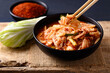 © nungning20 - Korean kimchi cabbage in a bowl eating by chopsticks, Asian fermented food, Still Life