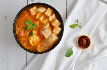 Wall Mural - Top view of Korean Kimchi Stew served with a side of red chili paste