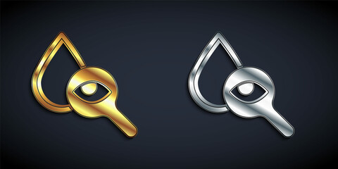 Wall Mural - Gold and silver Drop and magnifying glass icon isolated on black background. Long shadow style. Vector