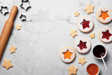 Traditional Linzer Cookies With Red And Yellow Jam. Cooking Christmas Background