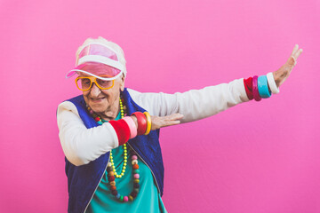 Wall Mural - Funny grandmother portraits. 80s style outfit. Dab dance on colored backgrounds. Concept about seniority and old people