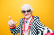 © oneinchpunch - Funny grandmother portraits. Senior old woman dressing elegant for a special event. granny fashion model on colored backgrounds