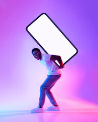 Poster - Young black guy carrying big heavy smartphone with empty screen on his back in neon light, full length. Mockup