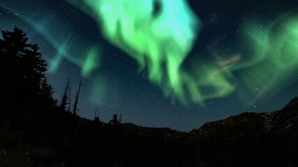 northern lights green loop winter mountain canyon