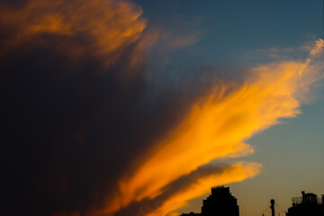 Wall Mural - An amazing caption of the sunset in winter days over the sea of Genova with beautiful red sky and some amazing clouds in the background