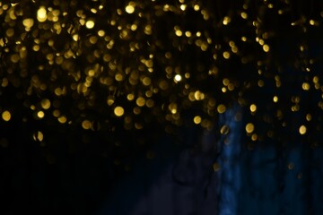 Wall Mural - Golden christmas lights blur background	