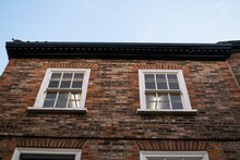 Windows On Facade Of Traditional British Brick House In York