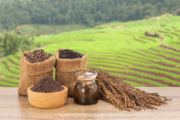 Rice berry on wood table isolated on nature background with clipping path.