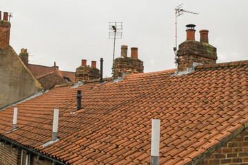 Wall Mural - Roof tiles and chimneys of British terraced houses in York England