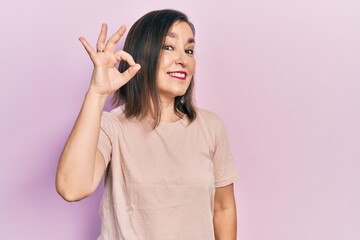 Poster - Middle age hispanic woman wearing casual clothes smiling positive doing ok sign with hand and fingers. successful expression.