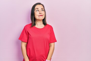 Canvas Print - Middle age hispanic woman wearing casual clothes smiling looking to the side and staring away thinking.